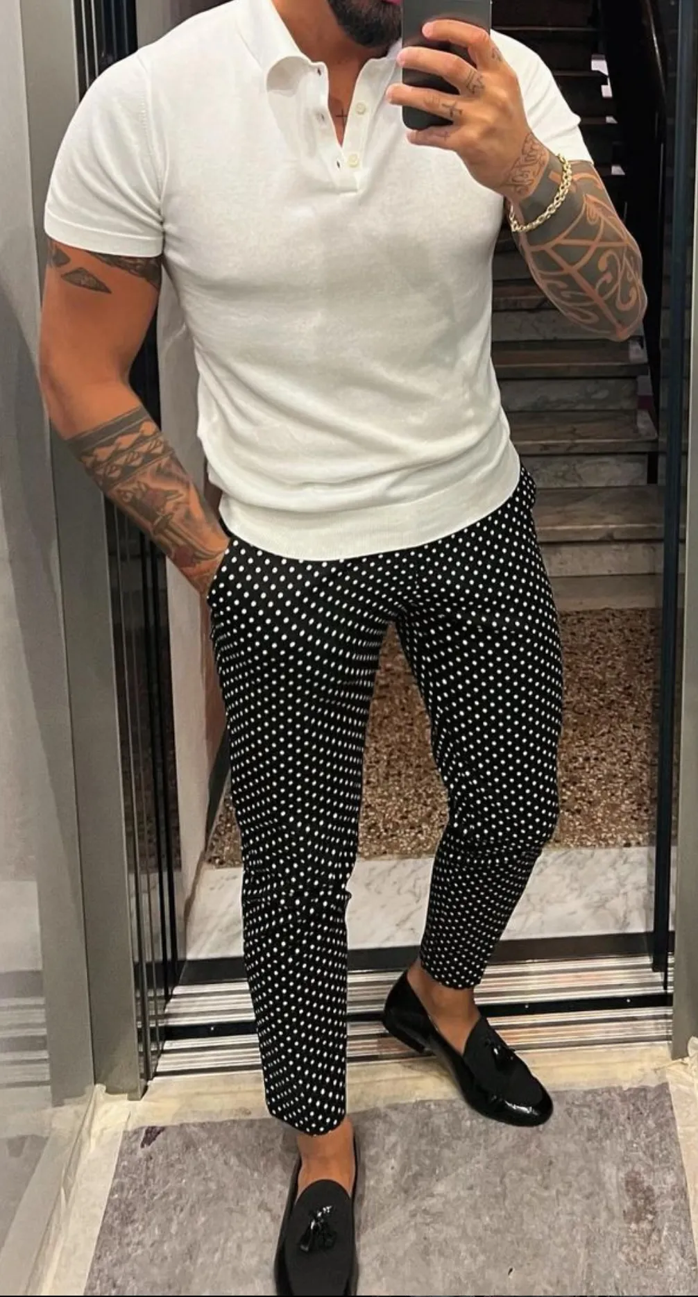 White polo and grey pants for a casual look